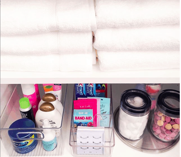 an organized bathroom shelf