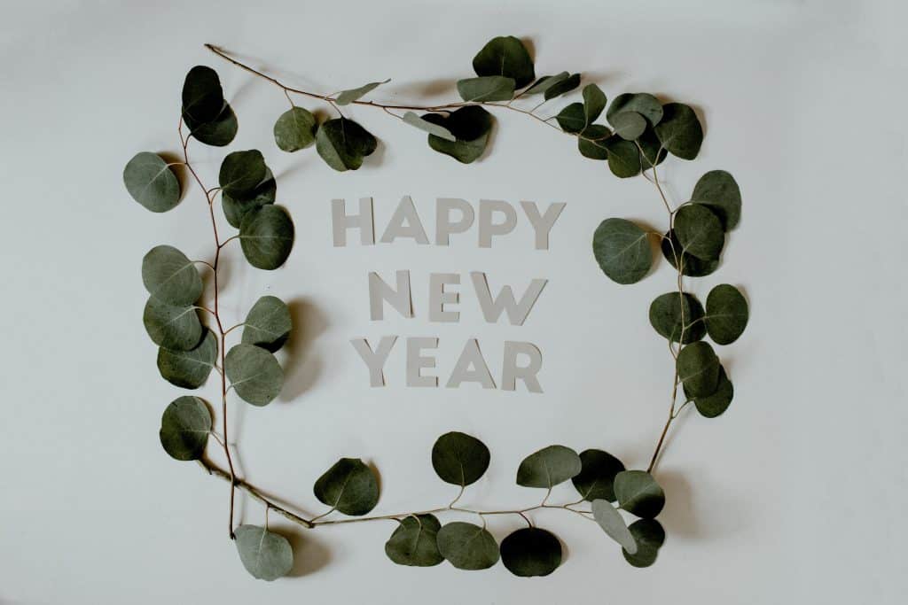 wreath with the words happy new year inside