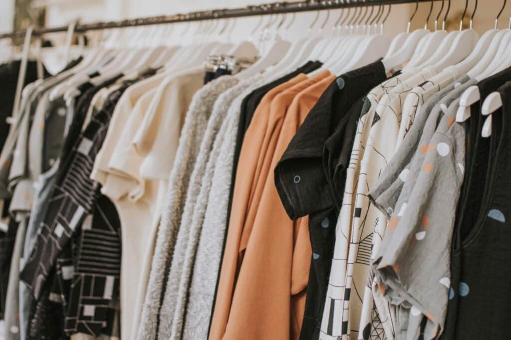 assorted shirts on a clothing rack