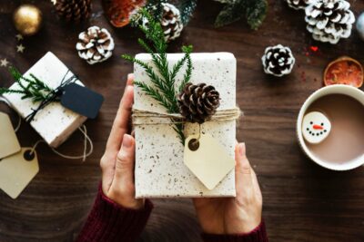 holiday gift package with pinecone decoration
