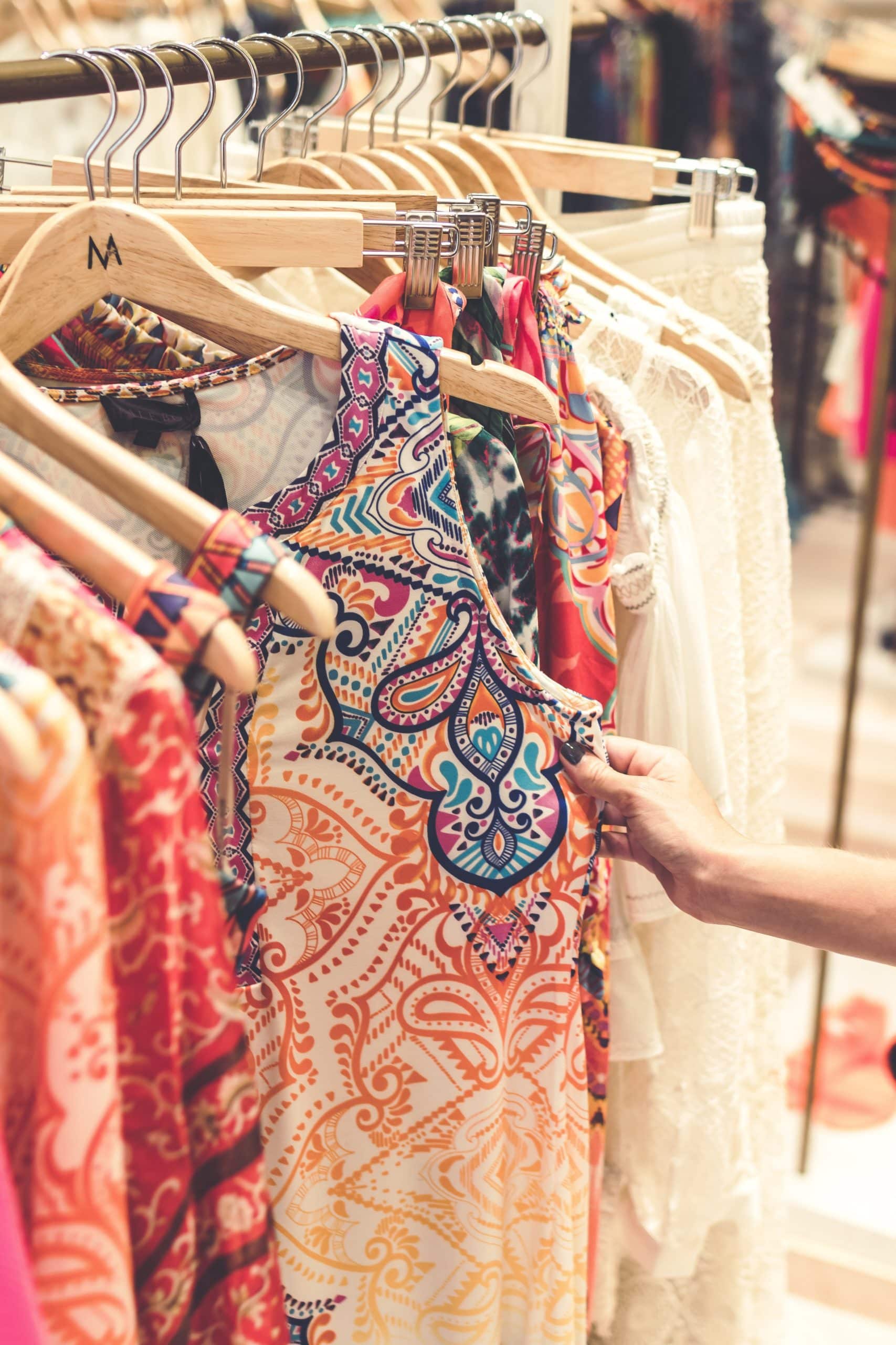 multi colored clothing on hangers
